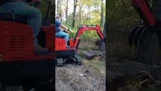 Gardner's GroundHog Excavator using New Log Grapple.