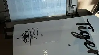 Exposing film positives for screen printing.