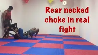 Rear necked choke application in real fight
