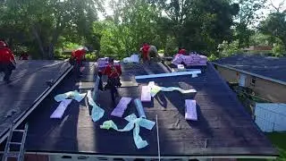 A.J. Wells Roofing Jacksonville Roof Replacement laying down Asphalt Architectural shingles