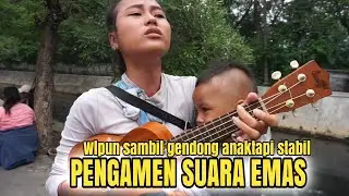 Pengamen suara merdu Wulan, walaupun sambil gendong tapi suaranya tetap stabil