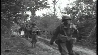 US 9th Division Infantrymen march along a road near Marigny after the D-Day invas...HD Stock Footage