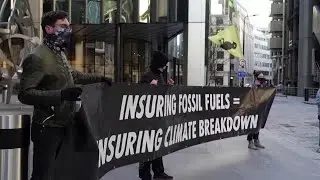 Climate activists dump fake coal at Lloyd's of London