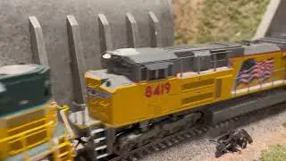UP 1995 and 8419 lug a track cleaning car past Tunnel 4