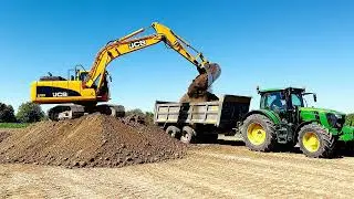 Jcb cutting soil and loading in tractor 