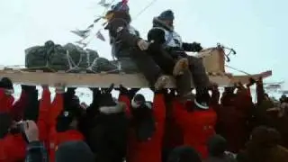 Ivakkak 2009 silver medalists hoisted on their sled
