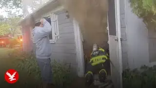 Firefighter crawls through smoke and broken glass to rescue elderly man from house fire