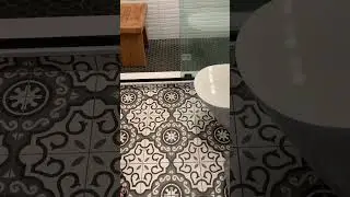 Quincy bath remodel with white wave tile and black fixtures!