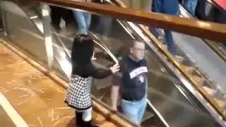 Cute Little Girl Says Hi from people in the escalator