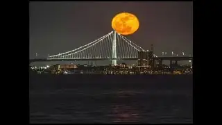 Timelapse: 'Pink' full moon rises over the Bay Bridge