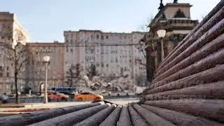 Wooden bench inviting to sit and contemplate Moscow cityscape