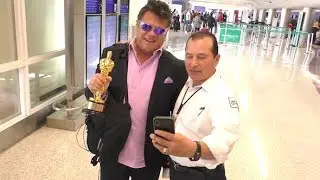 Green Book Writer/Producer Brian Currie Happily Displays His Oscar At LAX