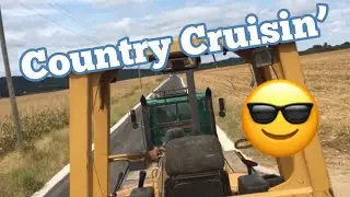 Country cruising - hauling heavy equipment with Mack truck