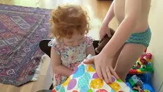 Blye opening a present from Nana & Grandpa