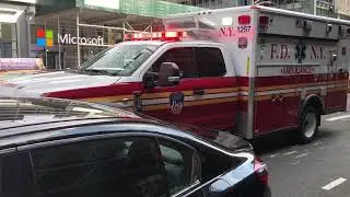 BRAND NEW FDNY EMS AMBULANCE RESPONDING IN HEAVY TRAFFIC ON 8TH AVENUE IN HELL'S KITCHEN, MANHATTAN.