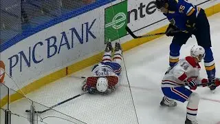 Byron helped off the ice after Parayko shoves him into the boards