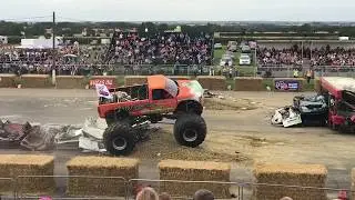 Monster trucks crushing caravans at Santa Pod Raceway