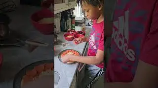 Bryce making pizza