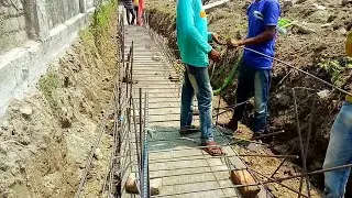 Construction of Reinforce Cement Concrete Drain with MS Rod binding.