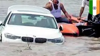Indian man pushes birthday BMW from dad into river - TomoNews