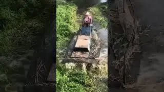 River water grass cutting and cleaning boat