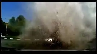 Car hit by water main break explosion2 in street Dash Cam 360P