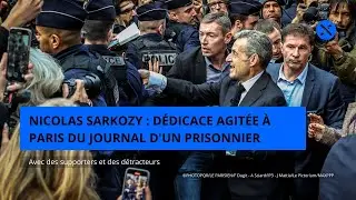 Supporters et d&eacute;tracteurs de Nicolas Sarkozy : d&eacute;dicace agit&eacute;e &agrave; Paris du Journal d'un prisonnier