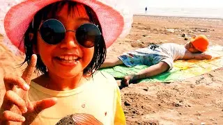 Hafiz and Aulia Fun Playing on the Beach