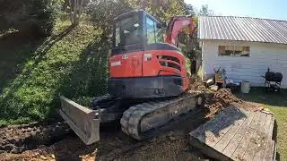 Digging a trench and installing a natural gas line.