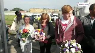 Botha family  light candles during memorial service for slain train driver Piet Botha
