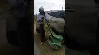 Uitenhage Basotho folding a Sesotho blanket for portability