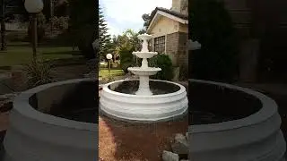 Amazing concrete fountain for your flower garden .