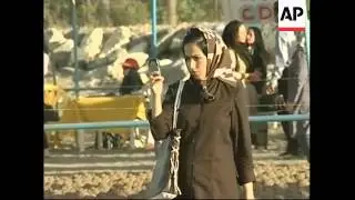 Women create sand sculptures on Iranian beach