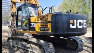JCB JS240LC excavator digging and loading Mercedes Actros 4150 (8x6) dump truck