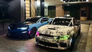 LOUD SCATPACK TEARS THROUGH DOWNTOWN AT NIGHT POV...