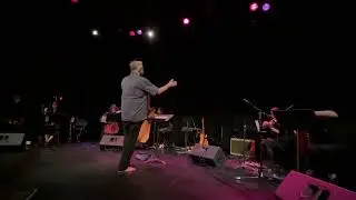 Fred Frith playing with & conducting the Modern Currents Ensemble. 