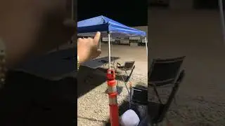 Canopy set up with metal post anchors & weight cones