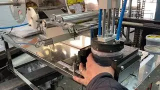 Rotuladora para tampas de potes