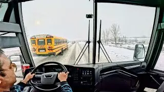 Bus drive in North America. Snow season
