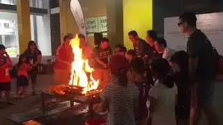 Desmond Lee lighting the first bonfire at the ActiveSG family camping event