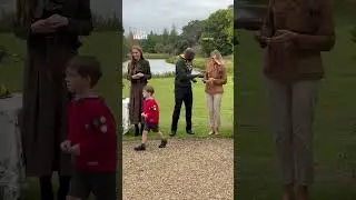 Kate Middleton and Melania Trump hand out scout badges to children