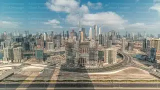 Panoramic skyline of Dubai with business bay and downtown district timelapse.