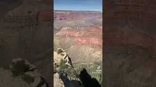 Stepping on the edge of the cliff at Grand Canyon National Park
