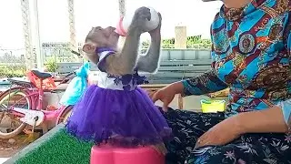 Looking very good my princess Ella sit to drinking milk with her new dress