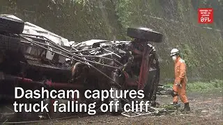 Dashcam captures truck falling off cliff