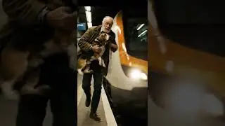 Elderly Individual Daringly Rescues Dog from Subway Tracks