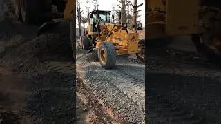 Motorgrander clearing mix for car patch on construction