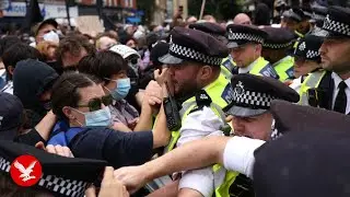 Police arrest protesters outside hotel housing immigrants