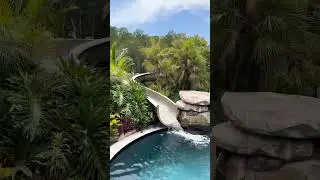 Insane Pool with a huge grotto, water slide, sun shelf, and so much more. #insanepools #lucaslagoons