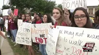 Student demonstrators walk out of classrooms to raise awareness about gun control
